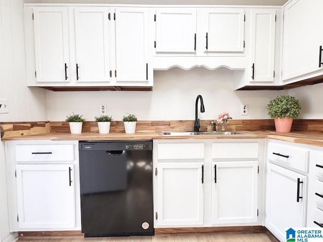 kitchen featuring a sink, white cabinets, and dishwasher