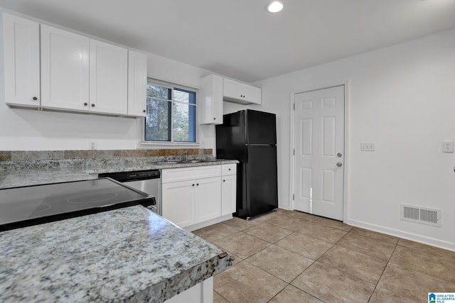 kitchen with visible vents, a sink, black appliances, and white cabinetry