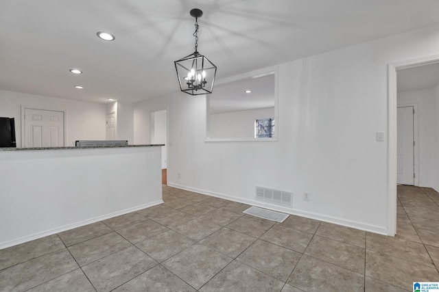 unfurnished dining area with tile patterned flooring, visible vents, baseboards, and recessed lighting