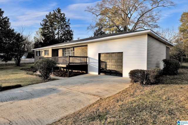 ranch-style house with a garage and driveway