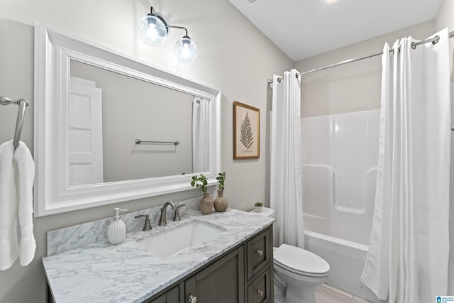 full bath featuring shower / tub combo, vanity, and toilet