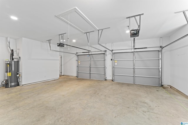 garage featuring water heater and a garage door opener