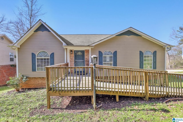 ranch-style home with a wooden deck