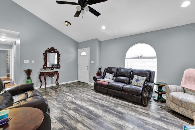 living area featuring a ceiling fan, lofted ceiling, baseboards, and wood finished floors