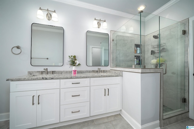 bathroom with crown molding, a stall shower, a sink, and double vanity