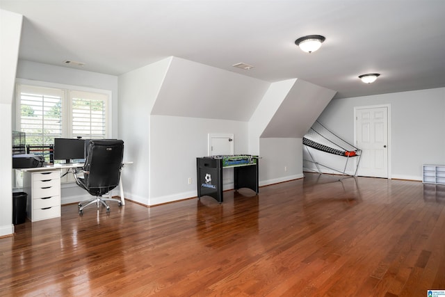 office area with lofted ceiling, baseboards, and wood finished floors