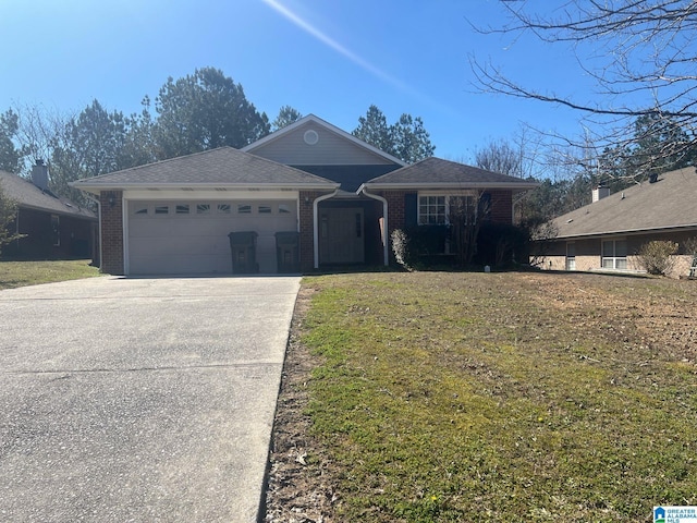 ranch-style house featuring an attached garage, a front yard, concrete driveway, and brick siding