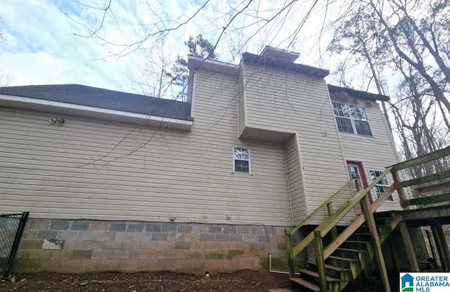 view of property exterior featuring stairs