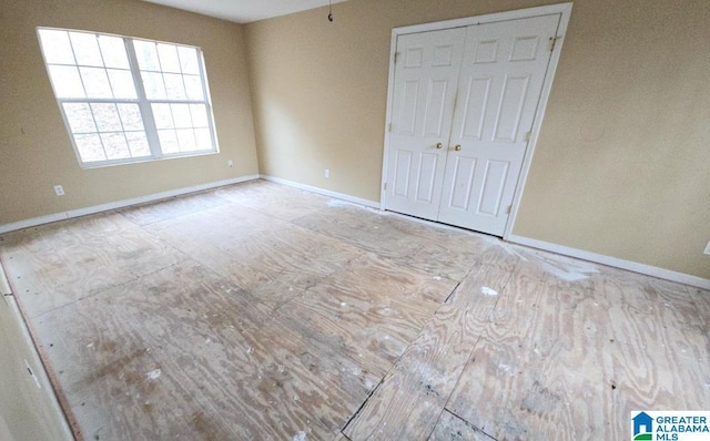 unfurnished bedroom with baseboards