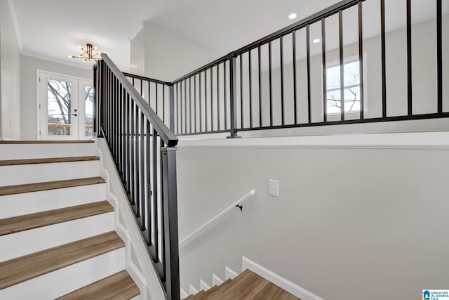 stairs with recessed lighting, baseboards, and wood finished floors