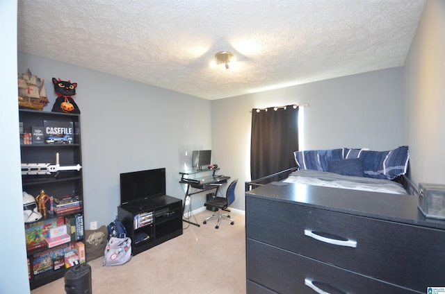 bedroom with carpet floors, a textured ceiling, and baseboards