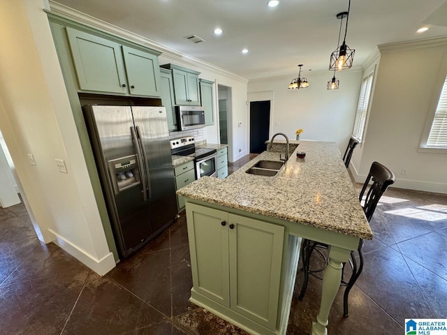 kitchen featuring a sink, visible vents, green cabinets, appliances with stainless steel finishes, and crown molding