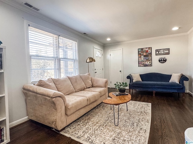 living area with baseboards, dark wood-type flooring, visible vents, and crown molding