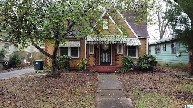 view of front of house with brick siding