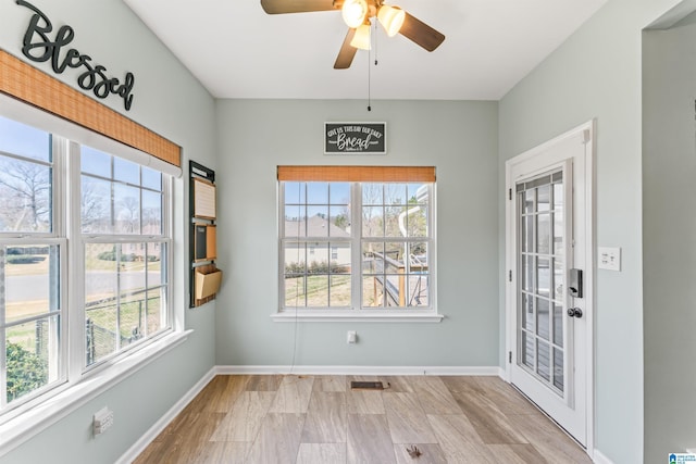 unfurnished dining area with baseboards, visible vents, and ceiling fan