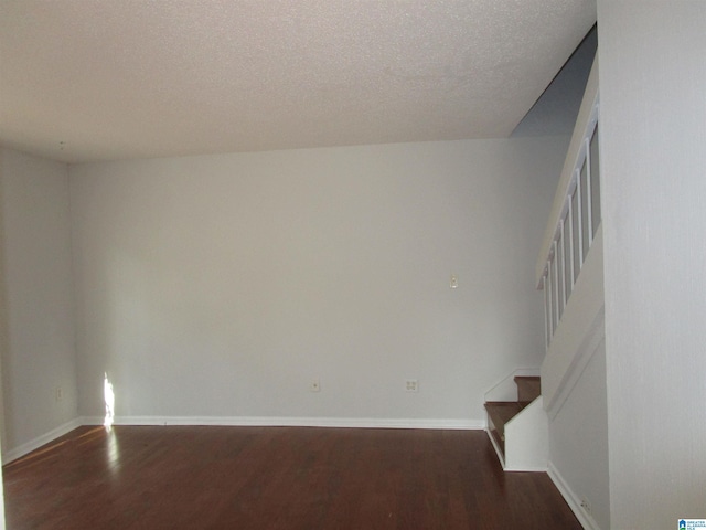 3830 Windhover Dr Unit 1, Vestavia Hills, AL 35216 - spare room with a textured ceiling, stairs, baseboards, and wood finished floors