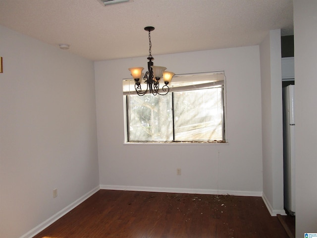 3830 Windhover Dr Unit 1, Vestavia Hills, AL 35216 - unfurnished dining area featuring a chandelier, wood finished floors, and baseboards