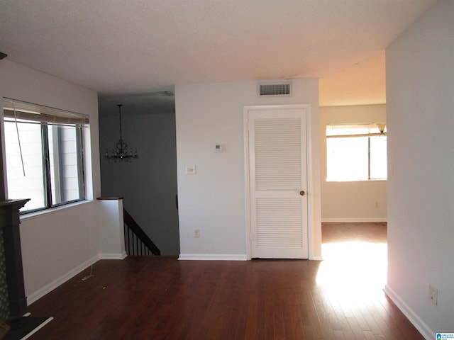 3830 Windhover Dr Unit 1, Vestavia Hills, AL 35216 - spare room with a healthy amount of sunlight, visible vents, baseboards, and wood finished floors