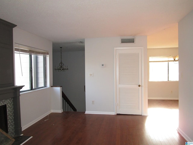 3830 Windhover Dr Unit 1, Vestavia Hills, AL 35216 - unfurnished living room with a healthy amount of sunlight, visible vents, a fireplace, and wood finished floors