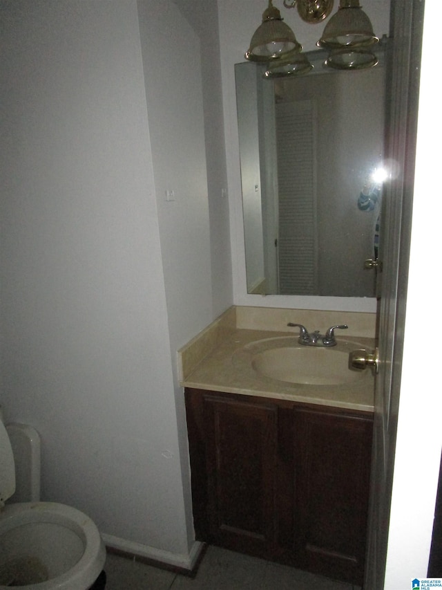 3830 Windhover Dr Unit 1, Vestavia Hills, AL 35216 - half bath with tile patterned flooring, toilet, a notable chandelier, vanity, and baseboards