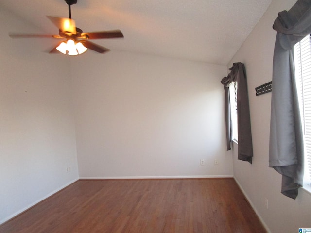 3830 Windhover Dr Unit 1, Vestavia Hills, AL 35216 - empty room with lofted ceiling, ceiling fan, wood finished floors, and baseboards