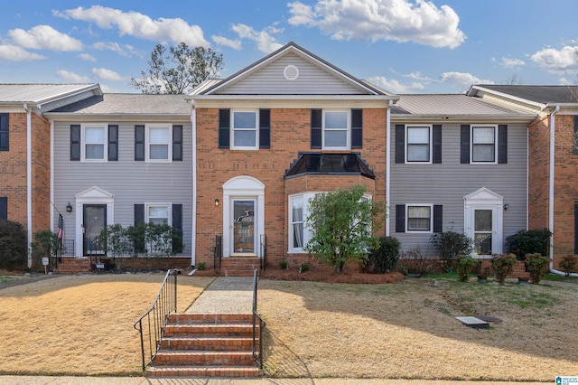 view of front of house with brick siding