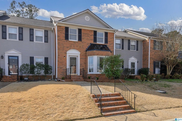 multi unit property featuring brick siding