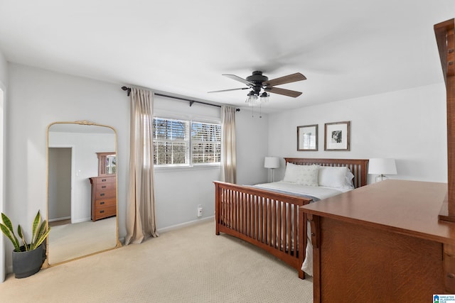 bedroom with carpet flooring, ceiling fan, and baseboards