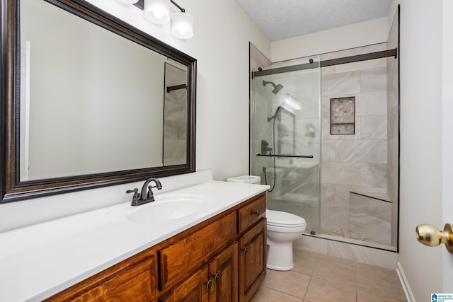 bathroom featuring a textured ceiling, tile patterned flooring, a shower stall, and toilet