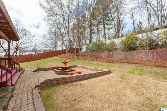 view of yard with a fenced backyard and a patio