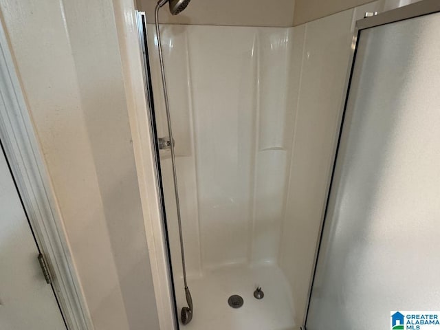 full bathroom featuring a stall shower