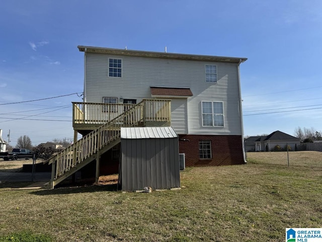 rear view of property featuring a lawn, stairway, fence, cooling unit, and a wooden deck