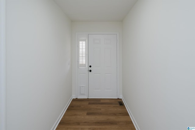 entryway featuring dark wood-style floors, visible vents, and baseboards