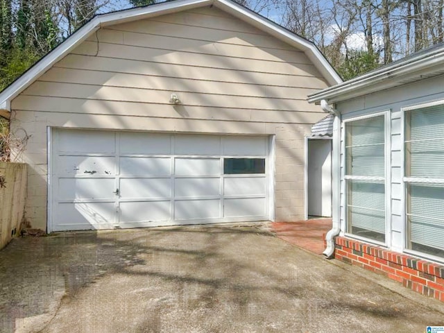 detached garage featuring driveway