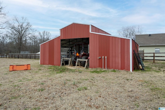 view of pole building featuring fence