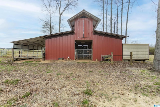 view of pole building featuring fence