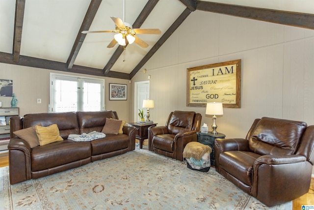 living room with a ceiling fan and vaulted ceiling with beams