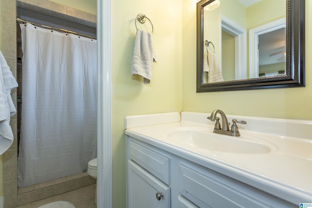 bathroom featuring toilet, tile patterned floors, curtained shower, and vanity