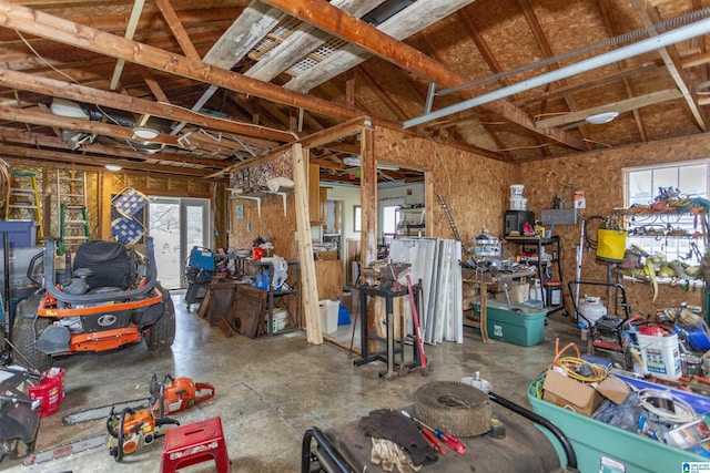 misc room featuring a garage and plenty of natural light