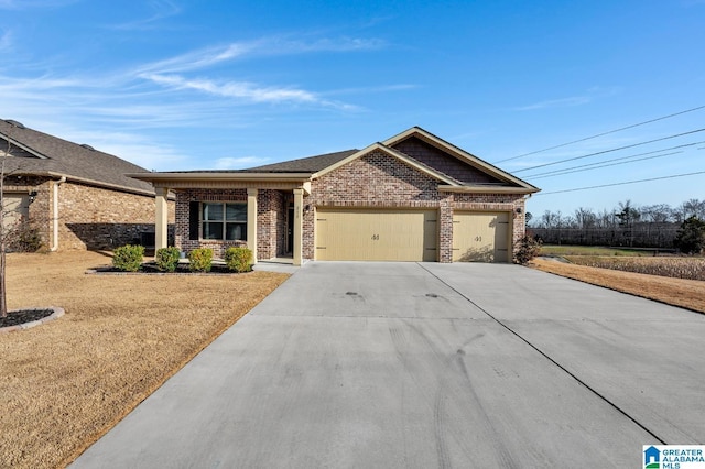 view of front facade featuring a garage, concrete driveway, brick siding, and a front lawn