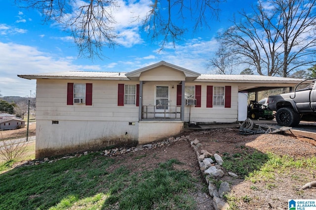 single story home featuring crawl space, metal roof, and an attached carport