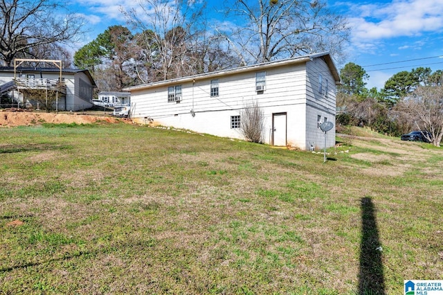 back of house featuring a yard