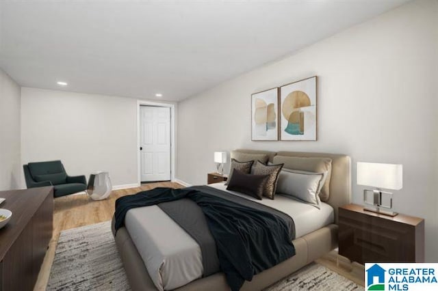 bedroom with light wood-style floors, recessed lighting, and baseboards