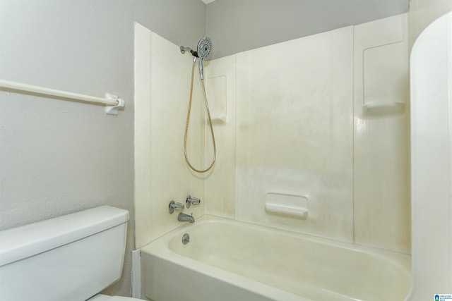 bathroom with shower / bathtub combination and toilet