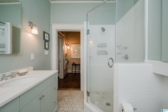 bathroom featuring tile patterned flooring, vanity, and a stall shower