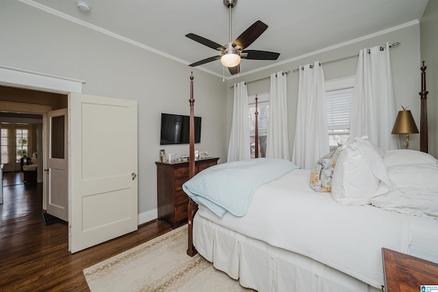 bedroom with baseboards, wood finished floors, a ceiling fan, and ornamental molding