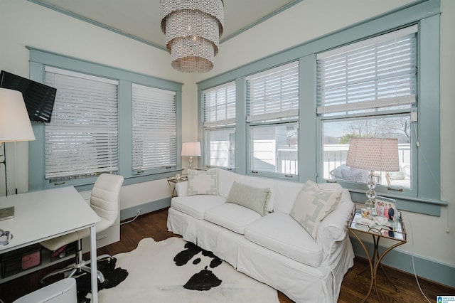 home office with a chandelier, baseboards, and wood finished floors