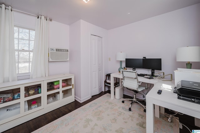 office area with cooling unit, wood finished floors, and baseboards