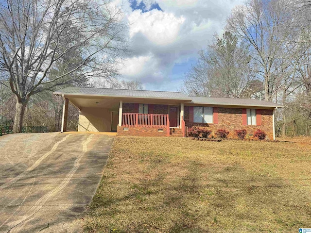 ranch-style home featuring an attached carport, brick siding, concrete driveway, crawl space, and a front yard