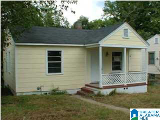 bungalow-style house with a porch and a chimney